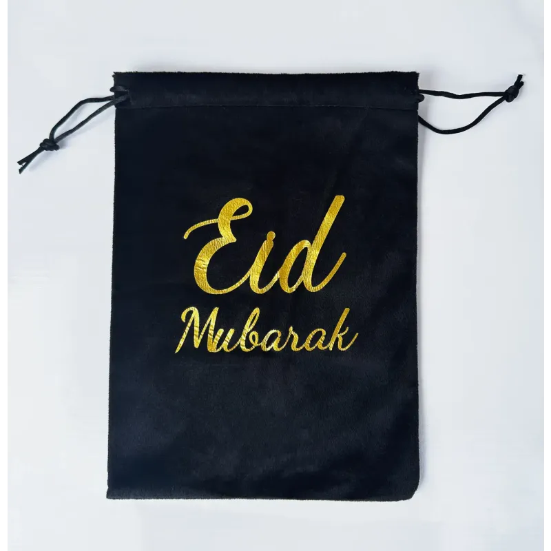 Zwarte drawstring pouch met gouden geborduurd Eid Mubarak, verkrijgbaar in zwart of wit